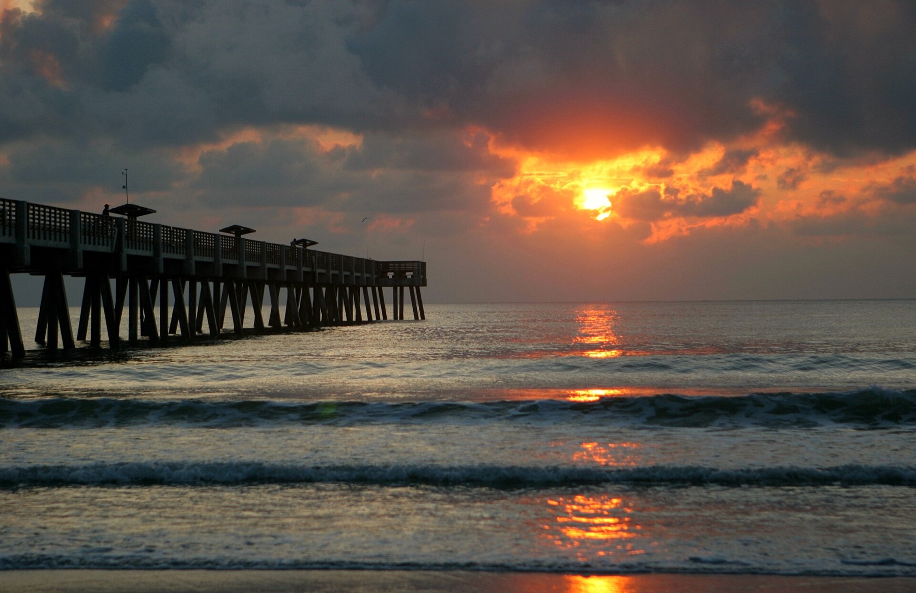 Jacksonville Beach Pier extending into the Atlantic at sunrise